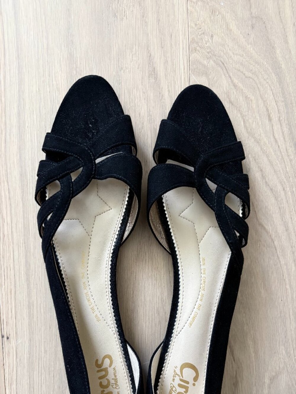 Black faux-suede peep-toe slip-ons
